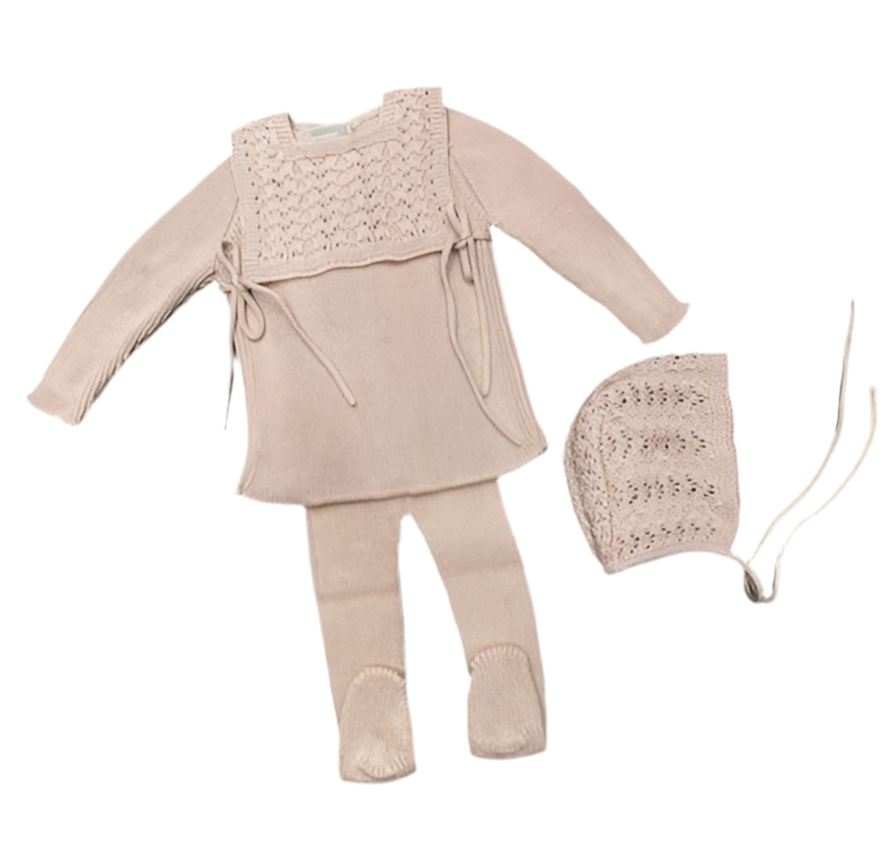 Baby outfit with top, leggings, and hat on a white background
